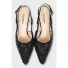 Black slingbacks decorated with rhinestones