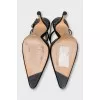 Black slingbacks decorated with rhinestones
