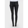 Black jeans of medium planting with lightning on trousers