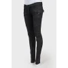 Black jeans of medium planting with lightning on trousers