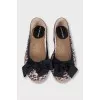 Animal print ballet flats with a bow