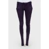 Purple suede jeans with gold hardware