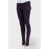 Purple suede jeans with gold hardware