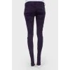 Purple suede jeans with gold hardware