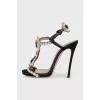 Black sandals decorated with crystals
