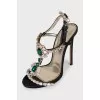 Black sandals decorated with crystals