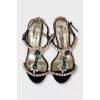 Black sandals decorated with crystals