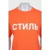 Orange T-shirt with a signature print