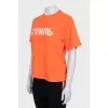 Orange T-shirt with a signature print