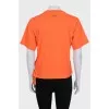 Orange T-shirt with a signature print