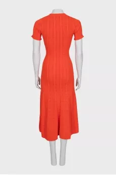 Fitted dress with buttons and perforations