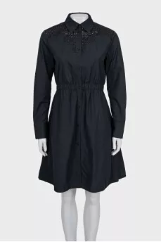 Black dress with decorative perforations