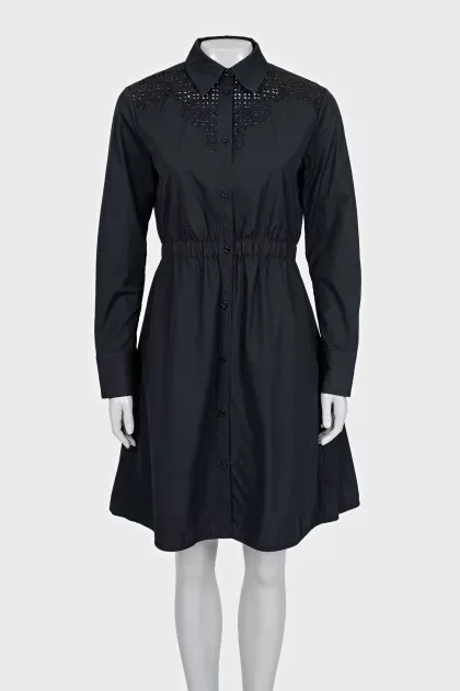 Black dress with decorative perforations