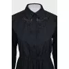 Black dress with decorative perforations
