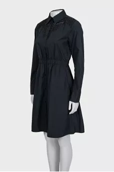 Black dress with decorative perforations