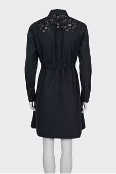 Black dress with decorative perforations