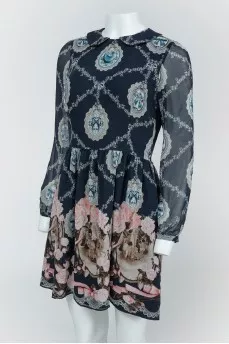 Blue dress with lightning drawings