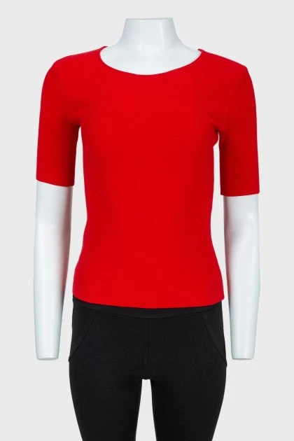 Red top with lacing on the back with a tag