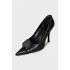 Black leather pumps with decoration