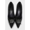 Black leather pumps with decoration