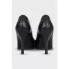 Black leather pumps with decoration