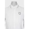 Men's white polo shirt with branded patch
