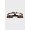 Black animal print flip flops