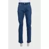 Men's blue jeans with a red stripe
