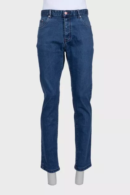 Men's blue jeans with a red stripe