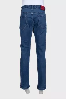 Men's blue jeans with a red stripe