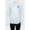 White shirt with blue embroidered brand logo