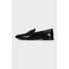 Leather loafers decorated with perforations