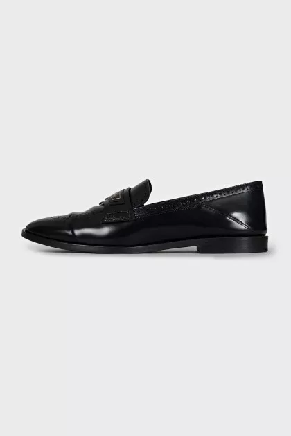 Leather loafers decorated with perforations