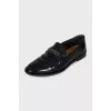 Leather loafers decorated with perforations