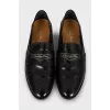 Leather loafers decorated with perforations