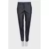 Blue trousers with silk inserts and tag