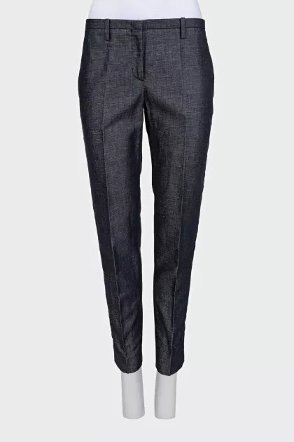 Blue trousers with silk inserts and tag