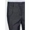 Blue trousers with silk inserts and tag
