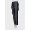 Blue trousers with silk inserts and tag