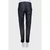 Blue trousers with silk inserts and tag