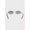 Oval shaped sunglasses in gold color