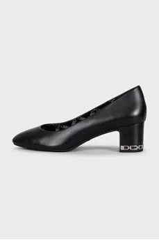 Black leather shoes with decorated heels