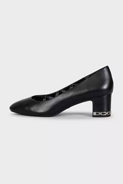 Black leather shoes with decorated heels