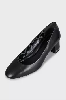 Black leather shoes with decorated heels