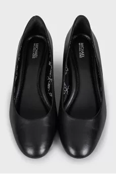Black leather shoes with decorated heels