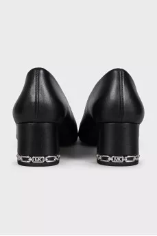 Black leather shoes with decorated heels