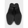 Black leather shoes with decorated heels
