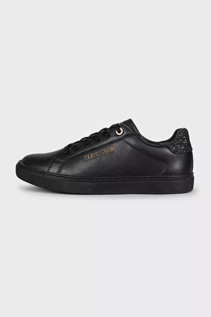 Black leather sneakers with a decorated heel
