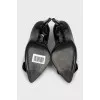 Patent leather shoes decorated with a bow