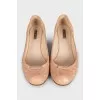 Pink leather ballet flats with signature weave